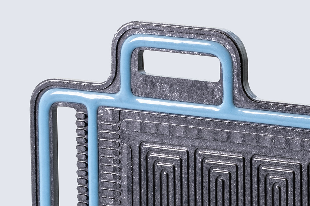 Close-up of a bipolar plate with a liquid silicone rubber (LSR) seal from Wevo.